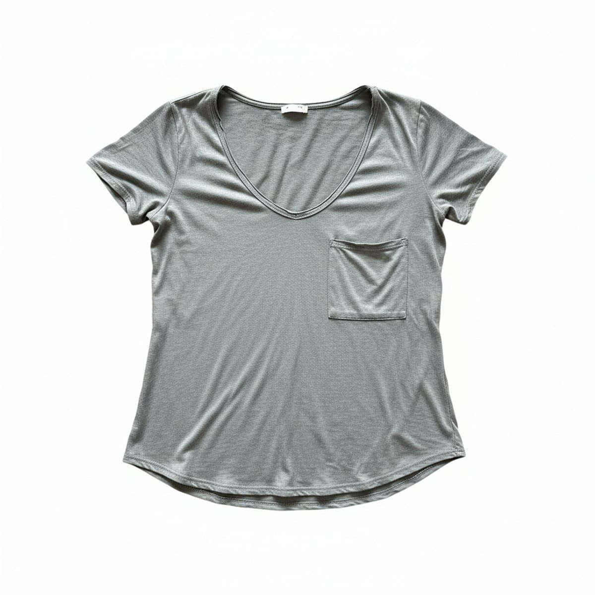 Womens minimalist heather grey deep V-neck t-shirt with chest pocket, soft lived-in fabric, available at handpicked306 boutique in Carlyle SK.