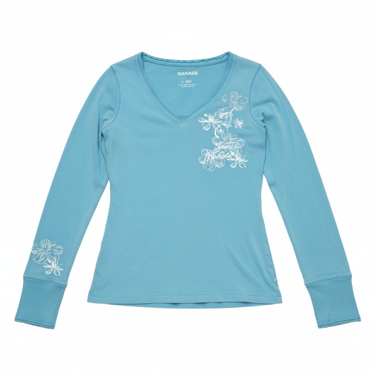 Women's vintage Garage baby blue long sleeve top with white floral graphic details, V-neck, size Small, available at handpicked306 boutique.
