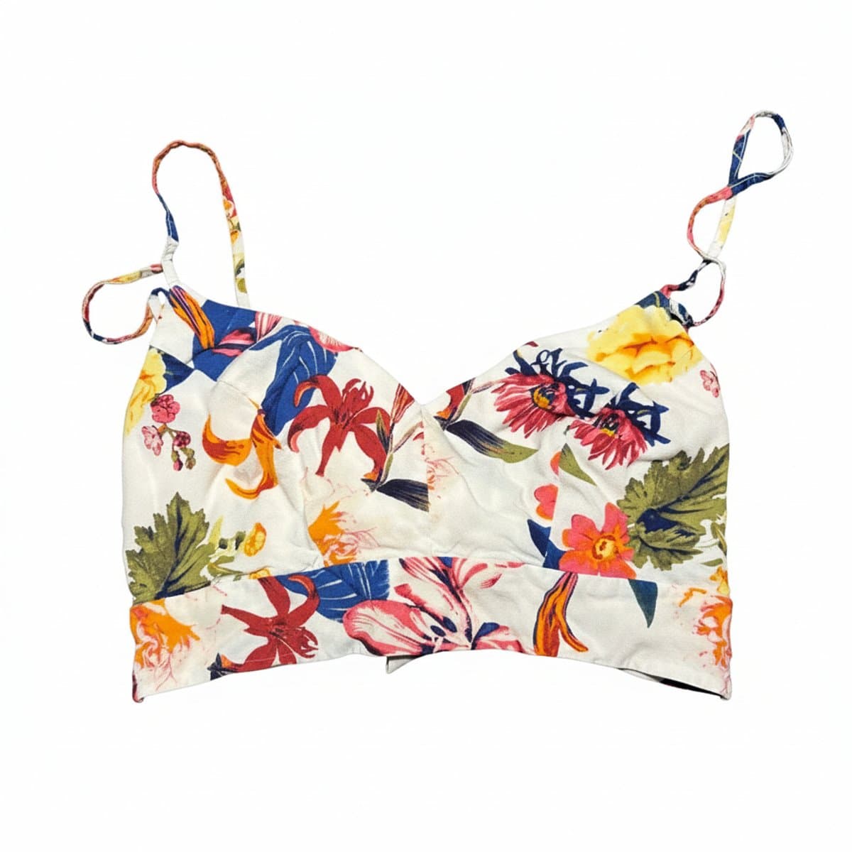 Women's floral print crop top with sweetheart neckline and spaghetti straps, vibrant botanical pattern, available at handpicked306 boutique.