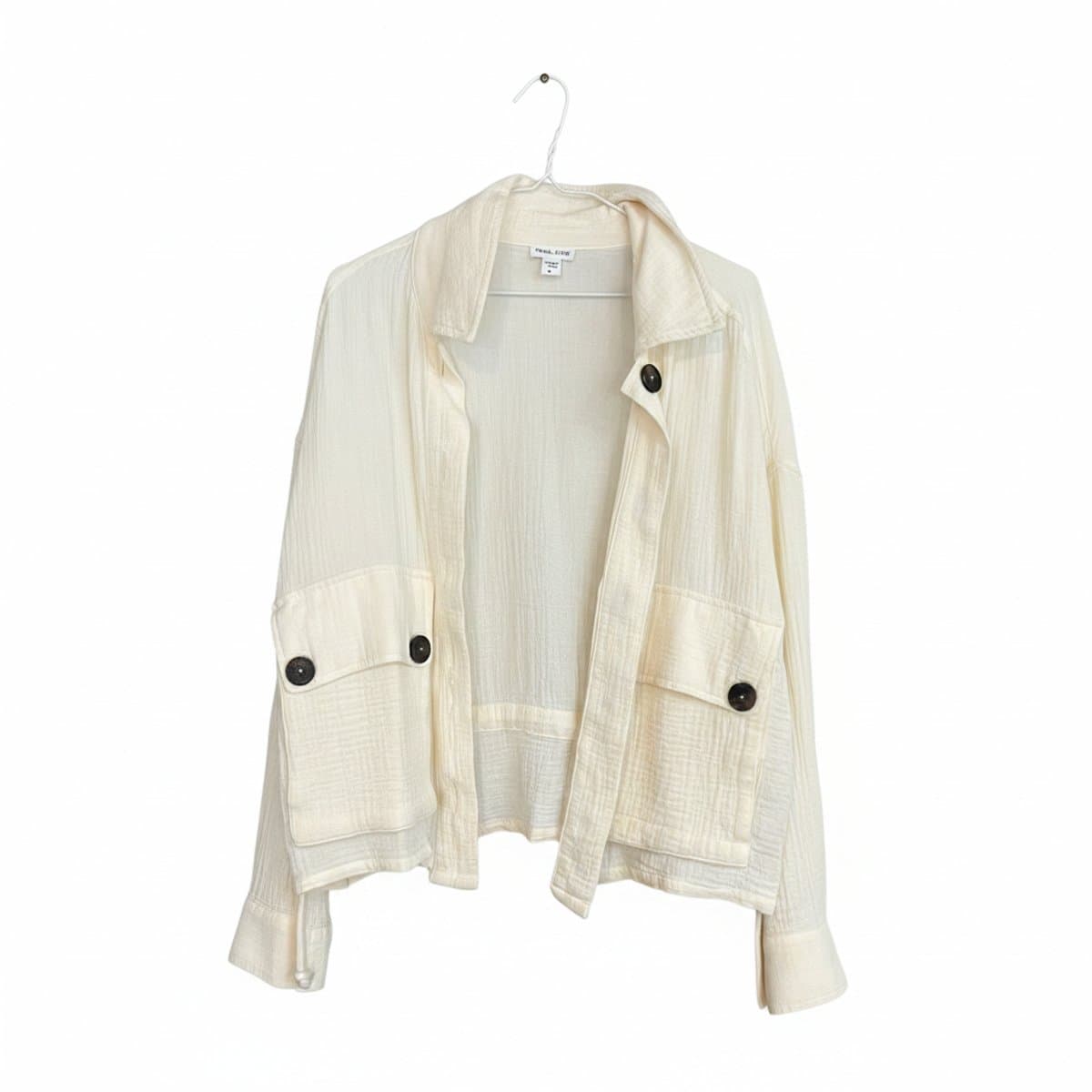 Women's Tribal Jeans cream textured utility shacket with contrast buttons, relaxed fit, available at handpicked306 boutique in Carlyle SK.