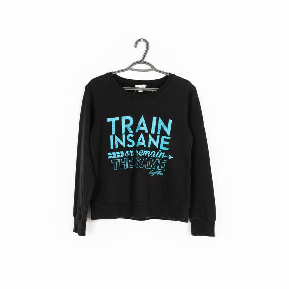 Women's Blogilates graphic sweatshirt in black with cyan text reading 'Train Insane or Remain The Same', available at handpicked306 boutique in Carlyle SK.