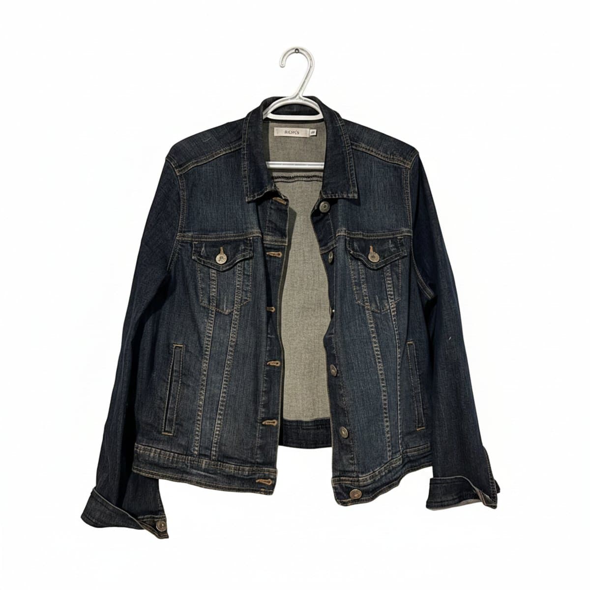 Ricki's dark wash denim jacket, women's size XS, classic fit with silver button detail, perfect for casual layering, available at handpicked306 boutique in Carlyle SK.