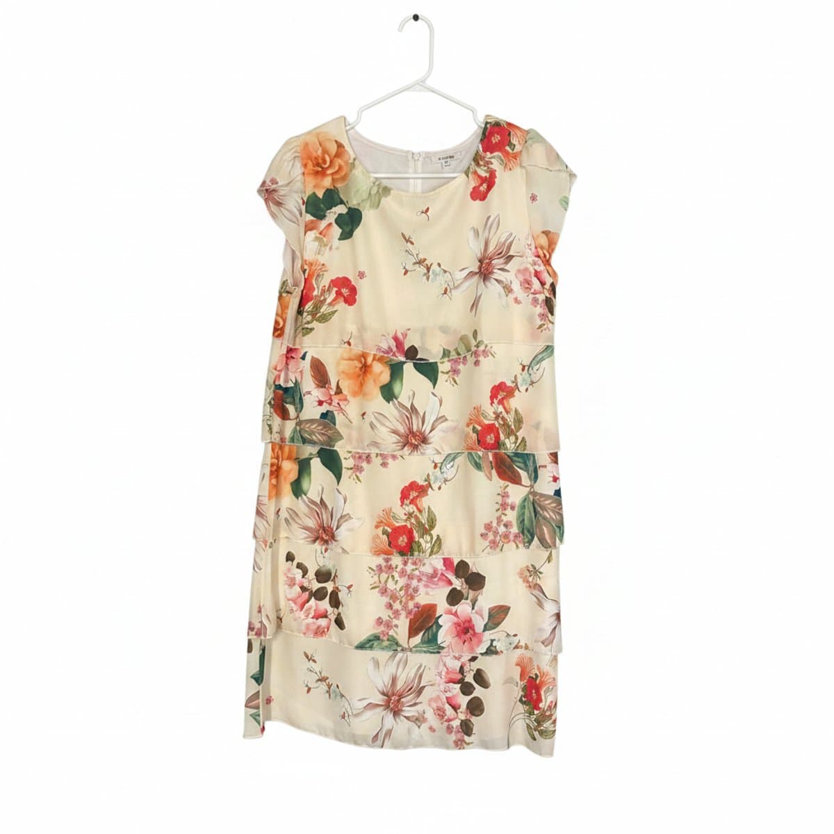 Women's cream floral tiered ruffle dress with flutter sleeves, romantic botanical print, available at handpicked306 boutique in Carlyle SK.