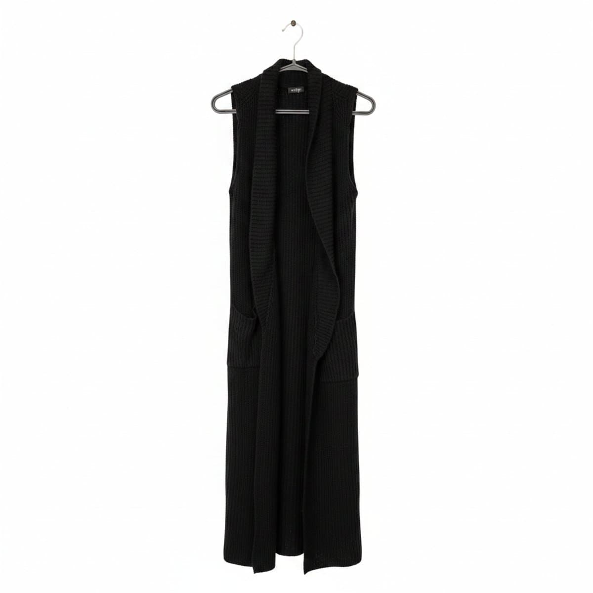 Eclip black sleeveless longline cardigan, open-front knit layering piece, minimalist style, available at handpicked306 boutique in Carlyle SK.