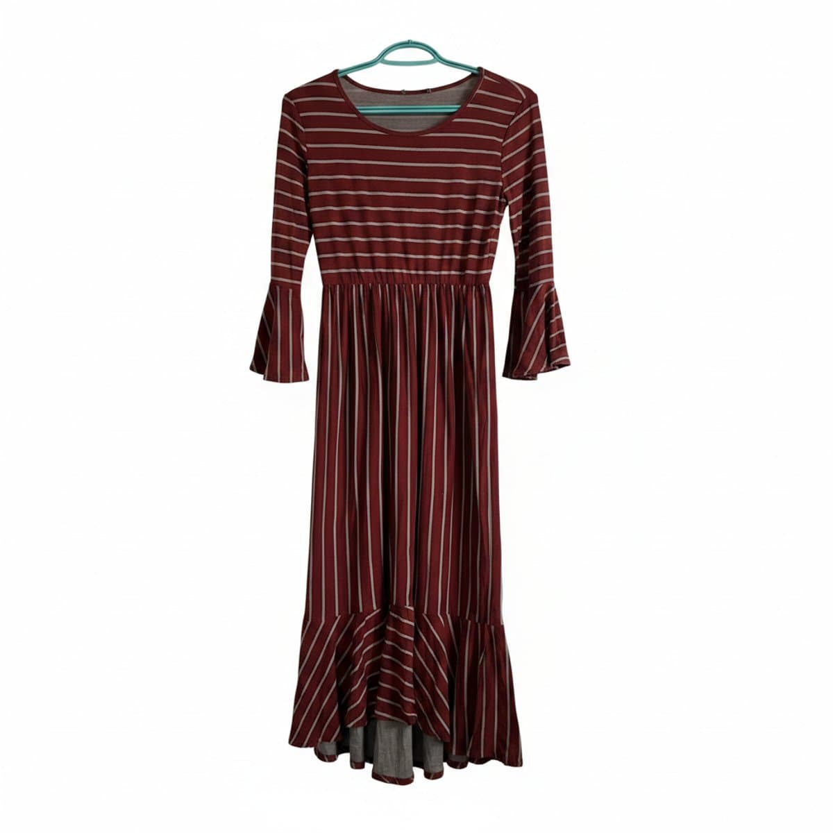 Womens maroon and grey striped midi dress with bell sleeves and fluted hem, hanging on a rack at handpicked306 boutique in Carlyle SK.