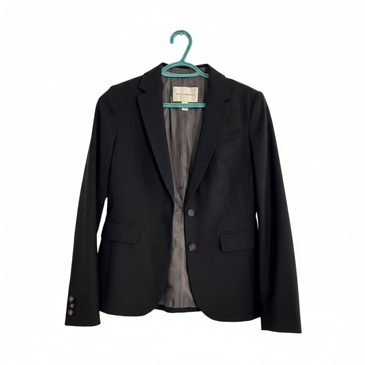 Banana Republic women's black tailored blazer with two-button closure and pinstriped interior lining, available at handpicked306 boutique.