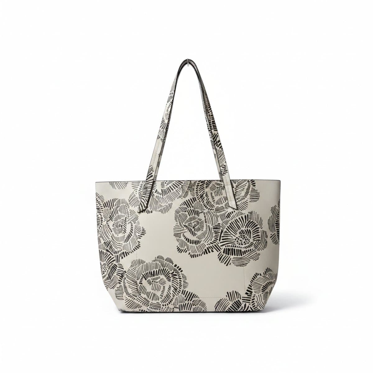 A stylish monochromatic white tote bag featuring black abstract floral sketches, double shoulder straps, available at handpicked306 boutique, perfect for minimalist and artsy fashion styles.