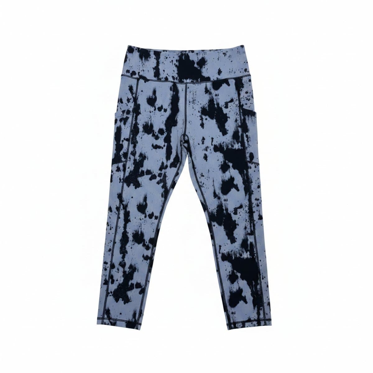 A pair of Aerie high-waisted leggings with a slate grey and black abstract tie-dye print, featuring side pockets, displayed on a wooden surface, available at handpicked306 boutique in Carlyle SK.