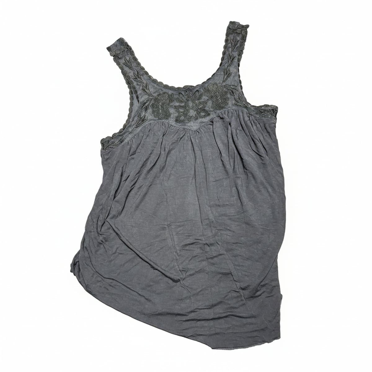 A charcoal grey women's tank top with intricate floral embroidery on the neckline, relaxed flowy fit, displayed for sale at handpicked306 boutique in Carlyle SK.