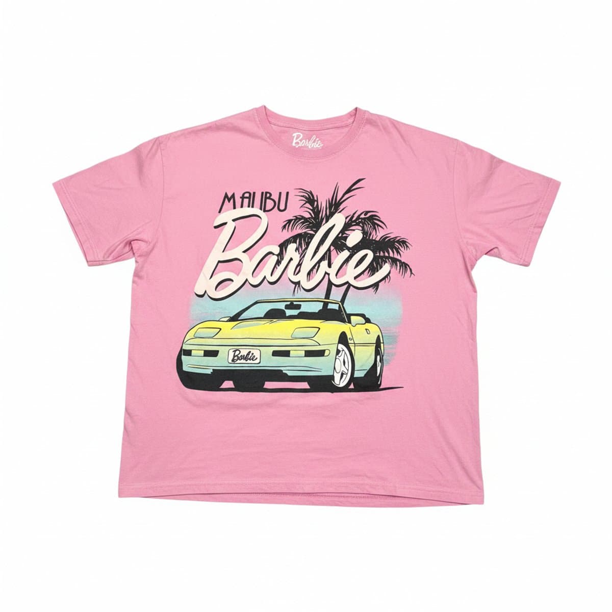 Women's pastel pink Malibu Barbie graphic t-shirt with convertible car print, short sleeves, crew neck, available at handpicked306 boutique in Carlyle SK.